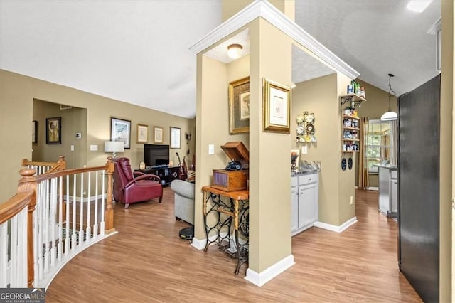 47 Powder Springs St, Hiram, GA 30141 - hall featuring an upstairs landing, light wood-style floors, and vaulted ceiling