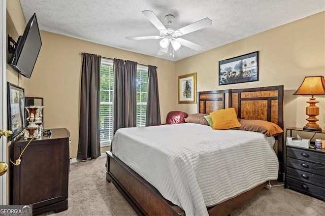 47 Powder Springs St, Hiram, GA 30141 - bedroom featuring light carpet, ceiling fan, and a textured ceiling