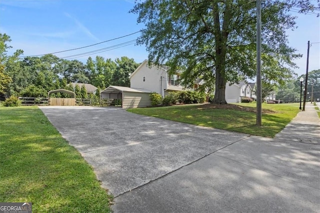 47 Powder Springs St, Hiram, GA 30141 - view of property exterior featuring a detached carport and concrete driveway