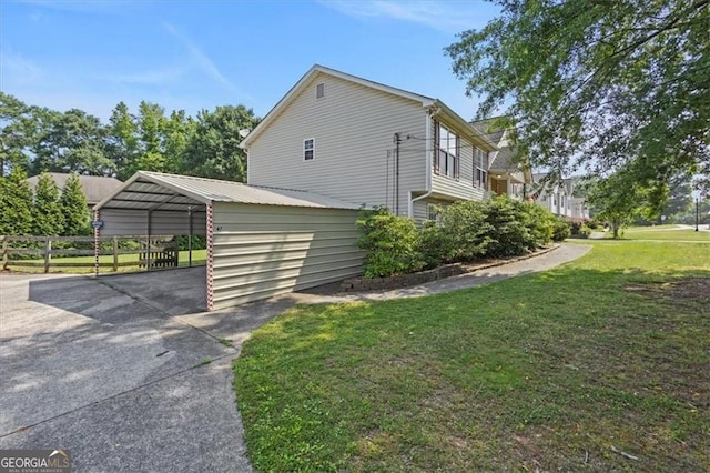 47 Powder Springs St, Hiram, GA 30141 - view of home's exterior featuring driveway and a detached carport