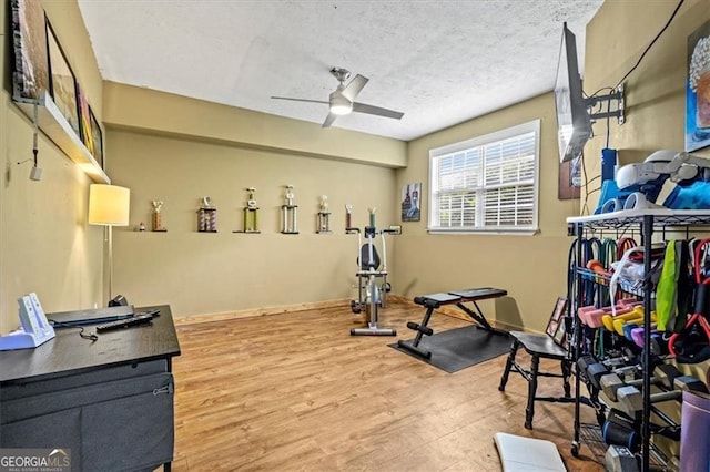 47 Powder Springs St, Hiram, GA 30141 - workout area with wood finished floors, a ceiling fan, and a textured ceiling