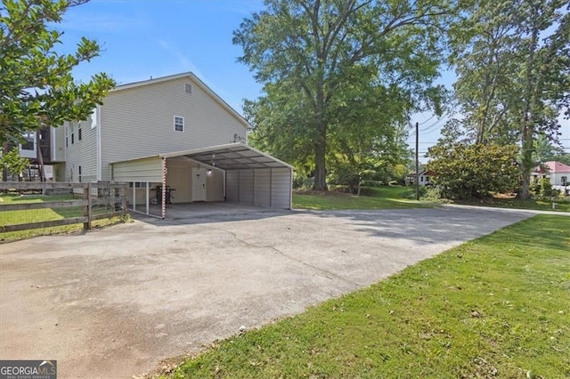 47 Powder Springs St, Hiram, GA 30141 - view of side of home featuring concrete driveway and a carport