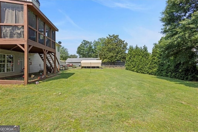 47 Powder Springs St, Hiram, GA 30141 - view of green lawn with a sunroom and stairway