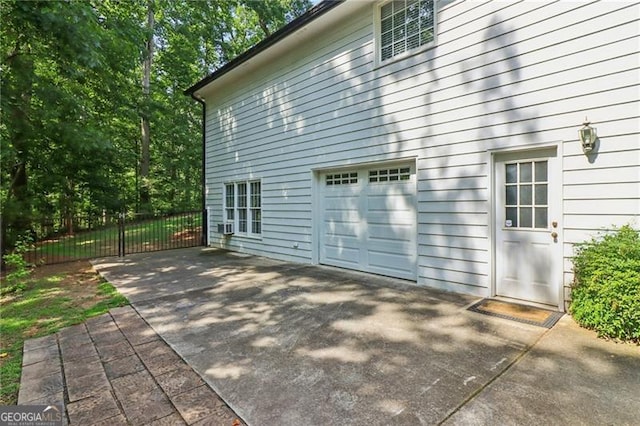 6030 Terrace Lake Pt, Flowery Branch, GA 30542 - view of side of home featuring an attached garage and driveway