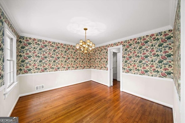 2179 Mountclaire Ct, Stone Mountain, GA 30087 - unfurnished room featuring plenty of natural light, a chandelier, wallpapered walls, wood finished floors, and crown molding