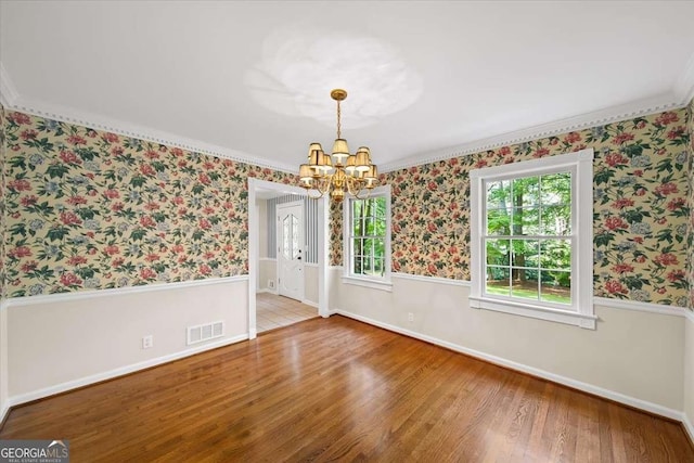 2179 Mountclaire Ct, Stone Mountain, GA 30087 - unfurnished room with a chandelier, wood finished floors, wallpapered walls, and ornamental molding