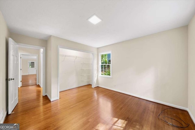 2179 Mountclaire Ct, Stone Mountain, GA 30087 - unfurnished bedroom with wood finished floors and a closet