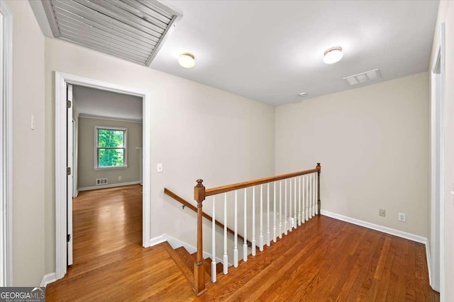 2179 Mountclaire Ct, Stone Mountain, GA 30087 - hallway featuring an upstairs landing and wood finished floors