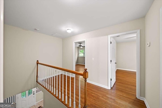 2179 Mountclaire Ct, Stone Mountain, GA 30087 - corridor featuring an upstairs landing and wood finished floors