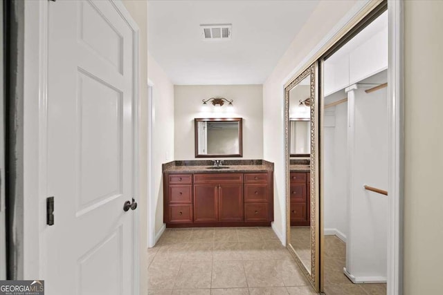 2179 Mountclaire Ct, Stone Mountain, GA 30087 - bathroom with vanity and tile patterned floors