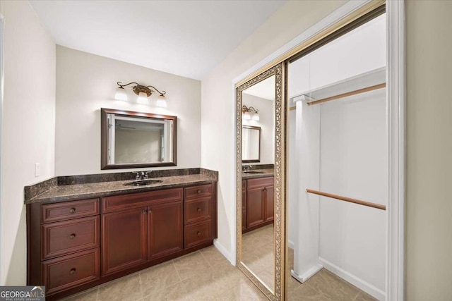 2179 Mountclaire Ct, Stone Mountain, GA 30087 - bathroom with vanity and tile patterned flooring