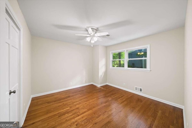 2179 Mountclaire Ct, Stone Mountain, GA 30087 - unfurnished bedroom featuring wood finished floors, a closet, and ceiling fan