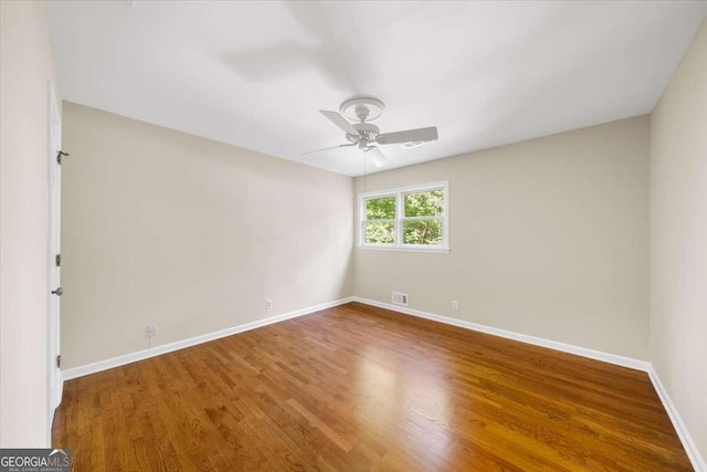 2179 Mountclaire Ct, Stone Mountain, GA 30087 - unfurnished room with ceiling fan and wood finished floors
