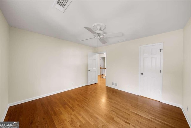 2179 Mountclaire Ct, Stone Mountain, GA 30087 - unfurnished bedroom featuring wood finished floors and a ceiling fan