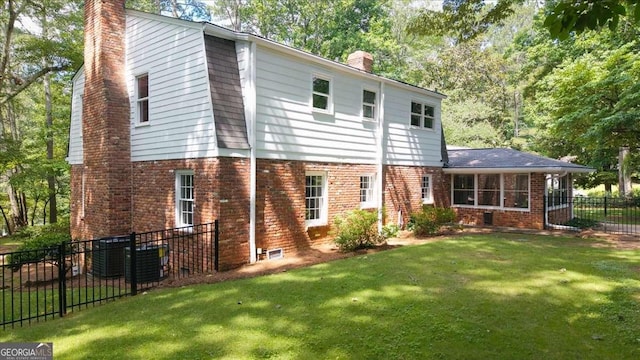 2179 Mountclaire Ct, Stone Mountain, GA 30087 - rear view of house with a chimney, brick siding, and view of wooded area