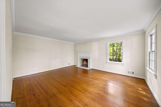 2179 Mountclaire Ct, Stone Mountain, GA 30087 - unfurnished living room with wood finished floors, ornamental molding, and a high end fireplace