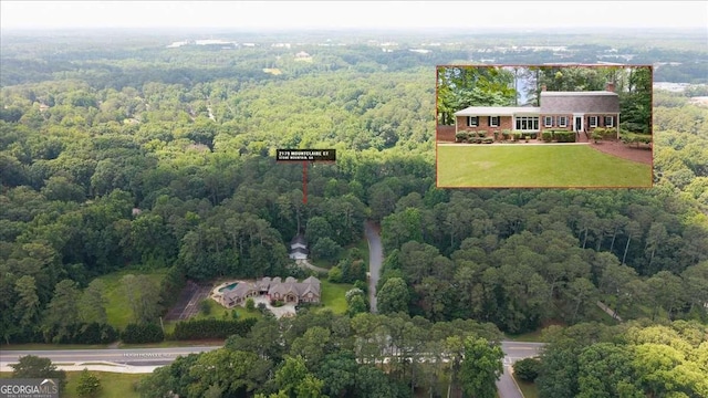 2179 Mountclaire Ct, Stone Mountain, GA 30087 - aerial overview of property's location featuring a heavily wooded area and property parcel outlined