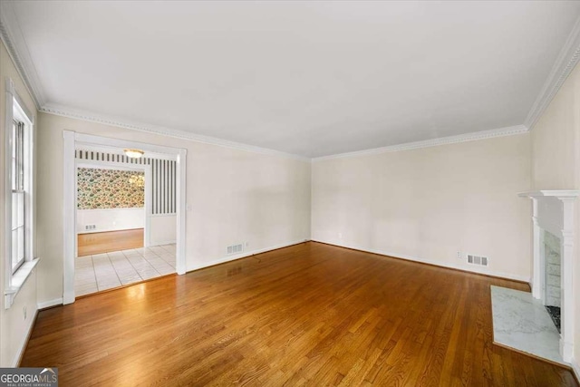 2179 Mountclaire Ct, Stone Mountain, GA 30087 - unfurnished living room featuring wood finished floors, ornamental molding, and a fireplace