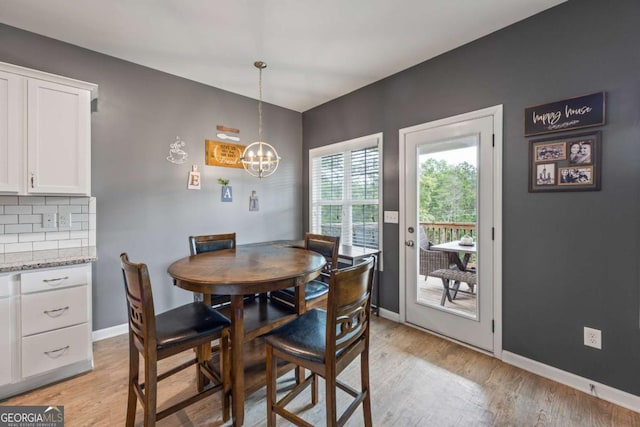 6422 Woodland Station Dr, Lula, GA 30554 - dining room with light wood-style floors and a chandelier