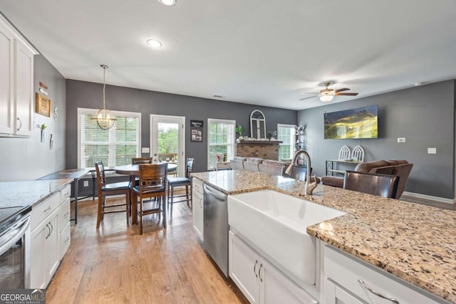 6422 Woodland Station Dr, Lula, GA 30554 - kitchen featuring stainless steel appliances, ceiling fan, white cabinetry, light wood-style floors, and recessed lighting