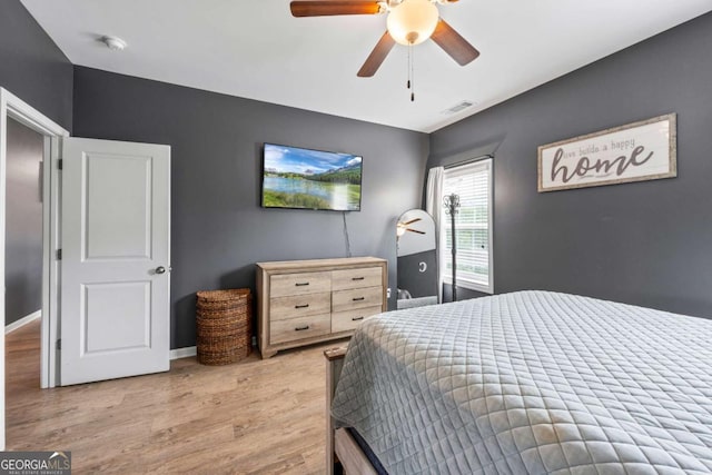 6422 Woodland Station Dr, Lula, GA 30554 - bedroom with light wood-type flooring and a ceiling fan