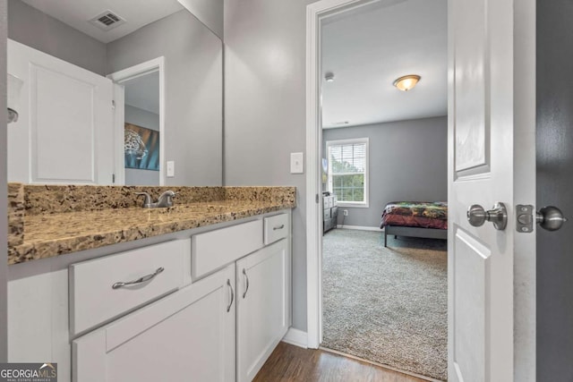 6422 Woodland Station Dr, Lula, GA 30554 - bathroom featuring ensuite bathroom, vanity, and wood finished floors