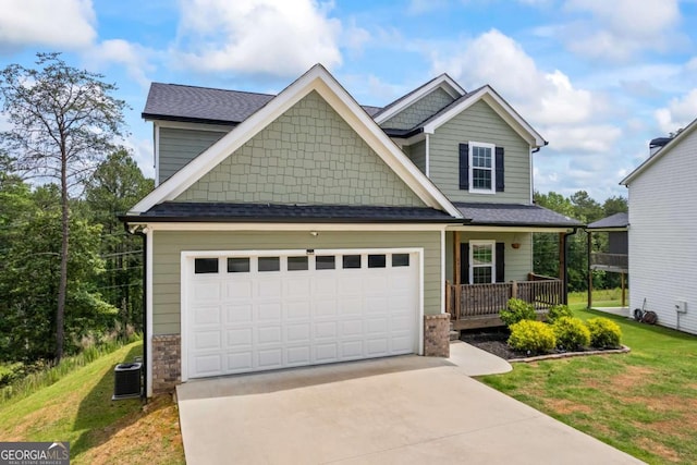 6422 Woodland Station Dr, Lula, GA 30554 - craftsman inspired home featuring concrete driveway, a porch, a garage, a front lawn, and roof with shingles