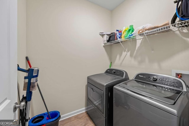 6422 Woodland Station Dr, Lula, GA 30554 - laundry room with independent washer and dryer and wood finished floors