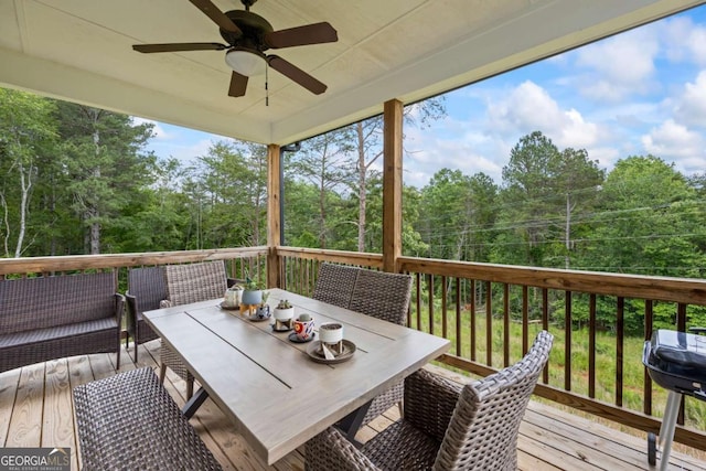 6422 Woodland Station Dr, Lula, GA 30554 - wooden terrace featuring a ceiling fan, view of scattered trees, outdoor dining area, and a grill