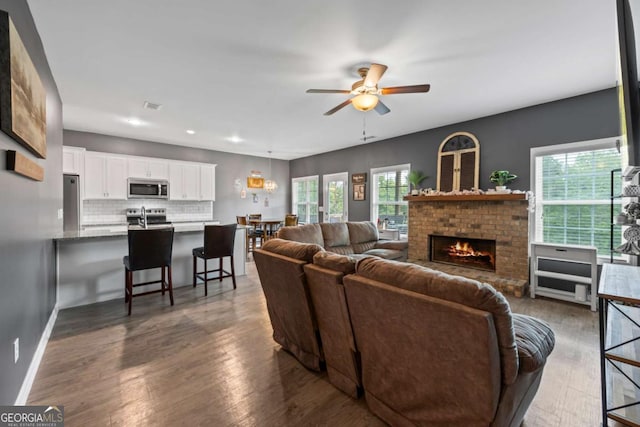 6422 Woodland Station Dr, Lula, GA 30554 - living area with a ceiling fan, a fireplace, wood finished floors, and recessed lighting