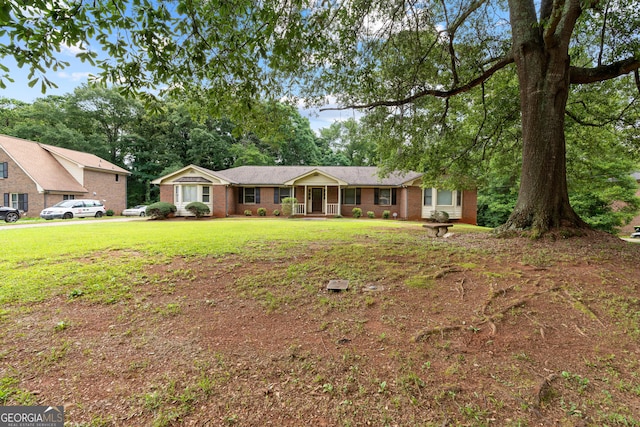 23-25 Sentry Oak Ct, Stockbridge, GA 30281 - view of front facade with a front lawn and brick siding