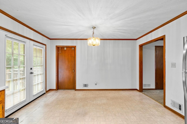 23-25 Sentry Oak Ct, Stockbridge, GA 30281 - spare room with light floors, crown molding, a chandelier, and french doors