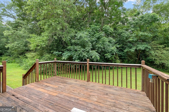 23-25 Sentry Oak Ct, Stockbridge, GA 30281 - wooden terrace with a lawn