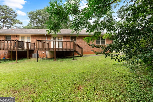 23-25 Sentry Oak Ct, Stockbridge, GA 30281 - back of house featuring brick siding, a lawn, a deck, and stairs