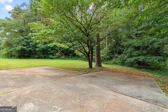 23-25 Sentry Oak Ct, Stockbridge, GA 30281 - view of green lawn with a patio area