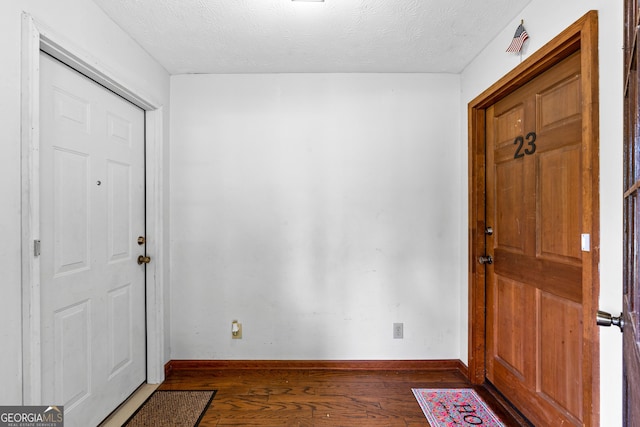 23-25 Sentry Oak Ct, Stockbridge, GA 30281 - foyer featuring hardwood / wood-style flooring and a textured ceiling