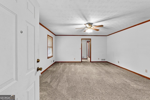 23-25 Sentry Oak Ct, Stockbridge, GA 30281 - carpeted empty room featuring a ceiling fan, ornamental molding, and a textured ceiling
