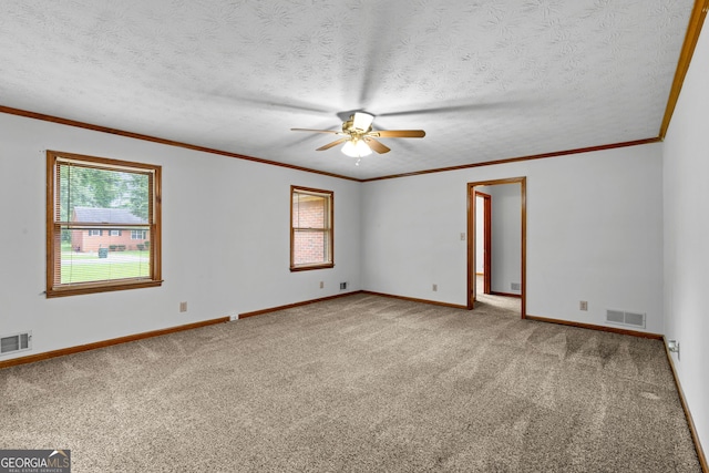 23-25 Sentry Oak Ct, Stockbridge, GA 30281 - carpeted spare room featuring ceiling fan, a textured ceiling, and crown molding