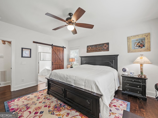105 Crestview Dr, Jefferson, GA 30549 - bedroom featuring a barn door, wood finished floors, ensuite bath, and a ceiling fan