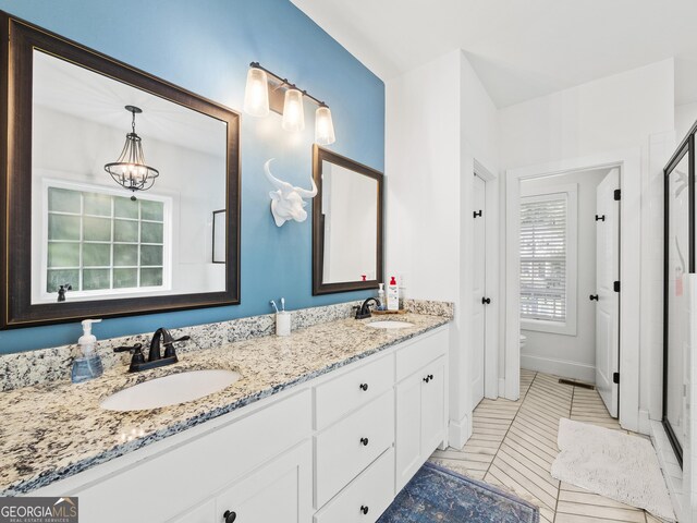 105 Crestview Dr, Jefferson, GA 30549 - full bath with double vanity, a chandelier, tile patterned floors, and a shower with door
