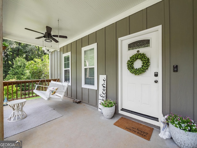 105 Crestview Dr, Jefferson, GA 30549 - view of exterior entry with a porch, board and batten siding, and ceiling fan