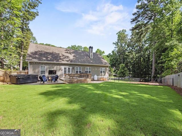 105 Crestview Dr, Jefferson, GA 30549 - rear view of property featuring a hot tub, a fenced backyard, a deck, a chimney, and roof with shingles