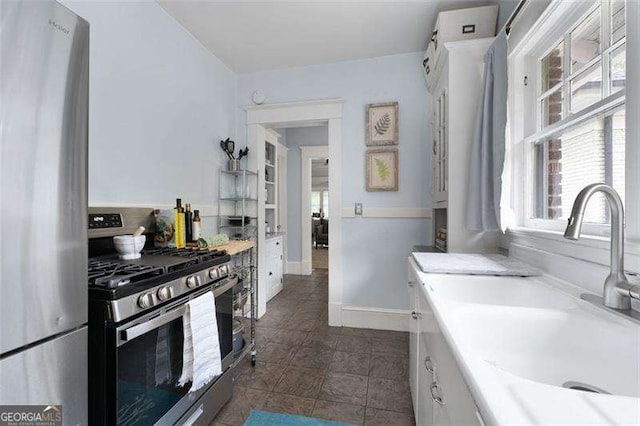 1300 N Ave NE, Atlanta, GA 30307 - kitchen featuring appliances with stainless steel finishes, light countertops, and dark tile patterned floors