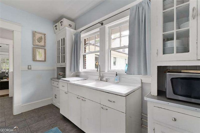 1300 N Ave NE, Atlanta, GA 30307 - bathroom featuring a sink and baseboards