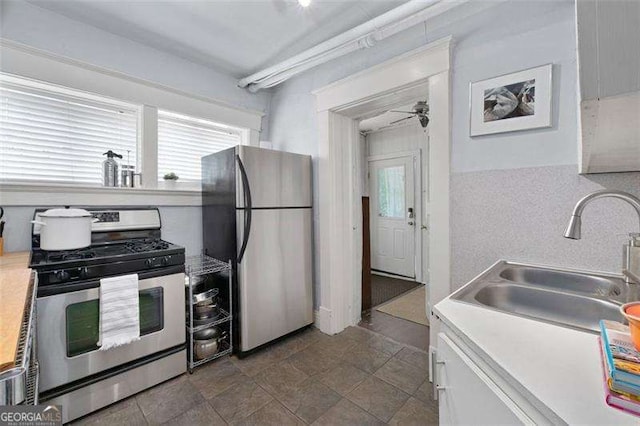 1300 N Ave NE, Atlanta, GA 30307 - kitchen with appliances with stainless steel finishes, light countertops, and a ceiling fan