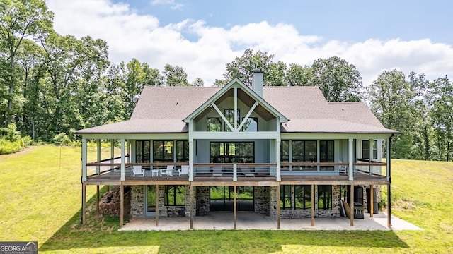 4384 Round Pond Rd, Lafayette, GA 30728 - rear view of property featuring a patio, a chimney, a lawn, and a deck