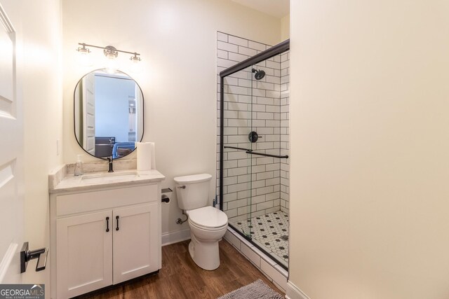 4384 Round Pond Rd, Lafayette, GA 30728 - full bath with a baseboard radiator, a stall shower, vanity, and wood finished floors