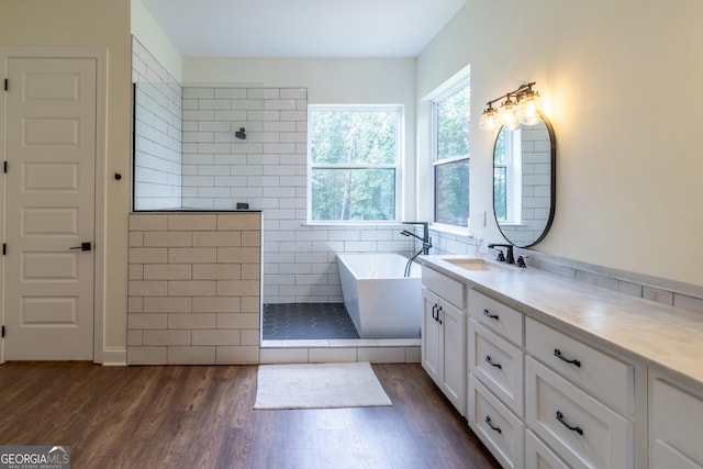 4384 Round Pond Rd, Lafayette, GA 30728 - bathroom featuring wood finished floors, walk in shower, vanity, and a freestanding tub
