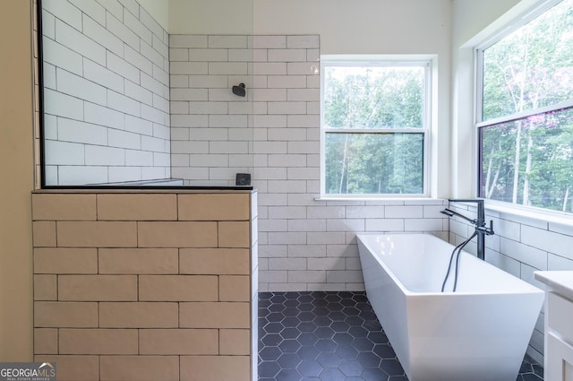 4384 Round Pond Rd, Lafayette, GA 30728 - full bathroom with tile walls, a soaking tub, tiled shower, and tile patterned flooring