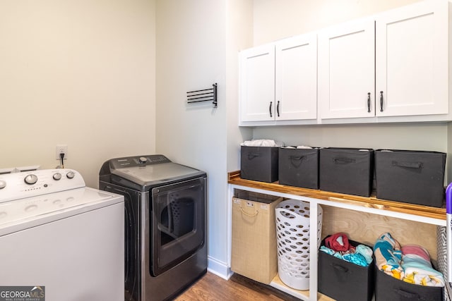 4384 Round Pond Rd, Lafayette, GA 30728 - laundry area featuring independent washer and dryer, cabinet space, and wood finished floors